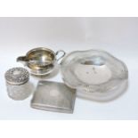 Silver items, to include a cream jug, cigarette case, pierced dish, silver topped jar, etc