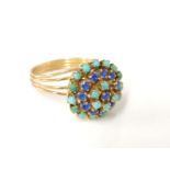 A gold synthetic blue spinel, turquoise and stained howlite cluster ring, tested as approximately
