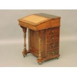 A late 19th century rosewood davenport, with four real drawers and four dummy drawers, 55cm wide