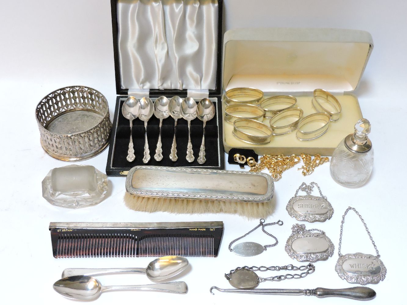 A small quantity of silver items, wine bottle coaster, decanter labels, silver backed brushes, a