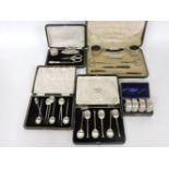 Cased silver items, including two manicure sets, bean coffee spoons, four napkin rings, six coffee