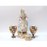 A large Continental porcelain figure of a lady, 39cm tall, a pair of Derby style porcelain urns,