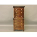 A reproduction bow front mahogany chest on chest, 62cm wide, 189cm high, and a small chest of