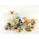 Five Goebel figures, four Beswick figures, and a Staffordshire spaniel