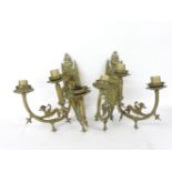 A pair of Victorian Gothic Revival twin branch three light brass wall lights