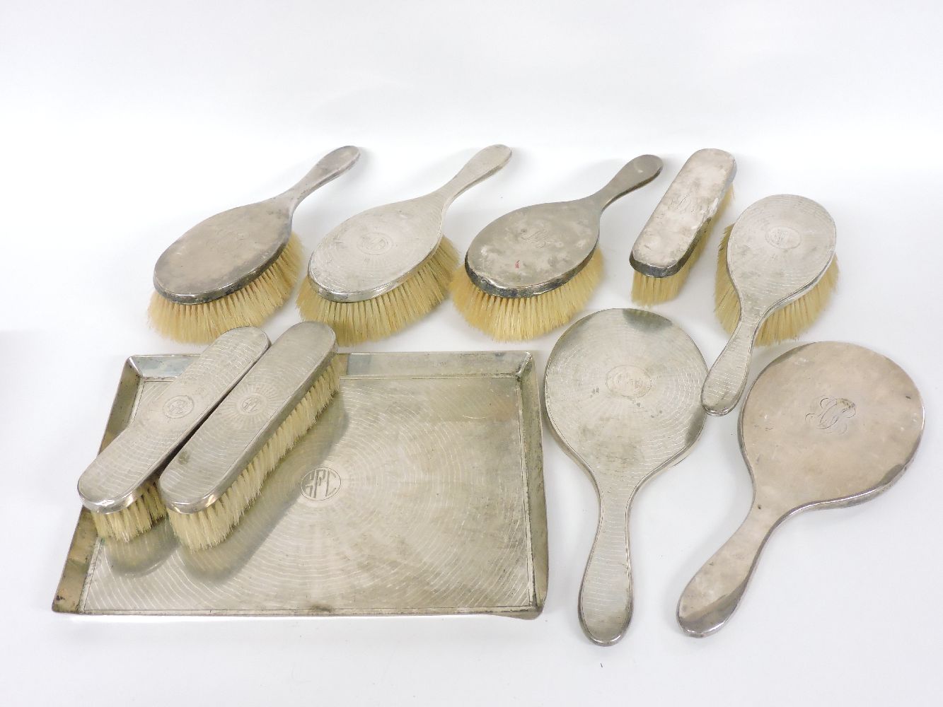 A silver six piece dressing table set, by the Goldsmiths' and Silversmiths' Company, London 1916,