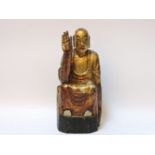 A wood sculpture of a Buddha, possibly Thai, gilded