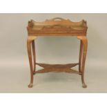 A good quality mahogany side table, with a removable tray top, with a shaped undertier, 73cm wide