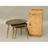 An Ercol nest of three 'pebble' tables, and an Art Deco burr walnut bedside cabinet
