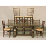 An oak draw leaf refectory table, and a set of eight matching rush seated ladder back chairs,
