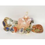 Royal Crown Derby paperweights, elephant and four birds, and a Royal Doulton figure 'Reverie'