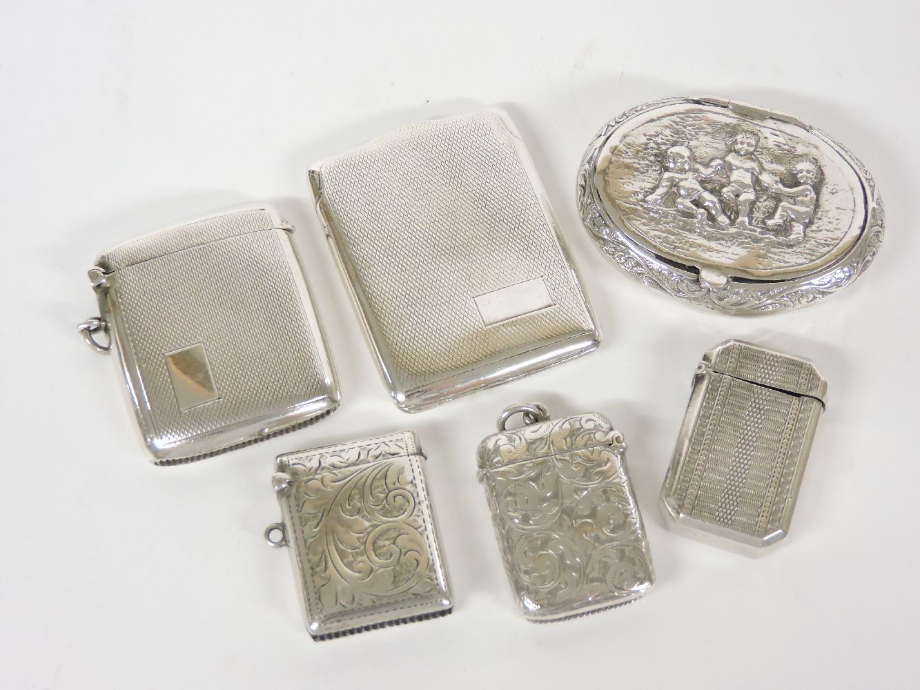 Four silver vesta cases, an oval 925 European box, and another vesta