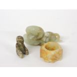 A jade ram, 7.2cm, an archer's ring carved with chilong, 3.8cm, and a kneeling figure, 3.5cm