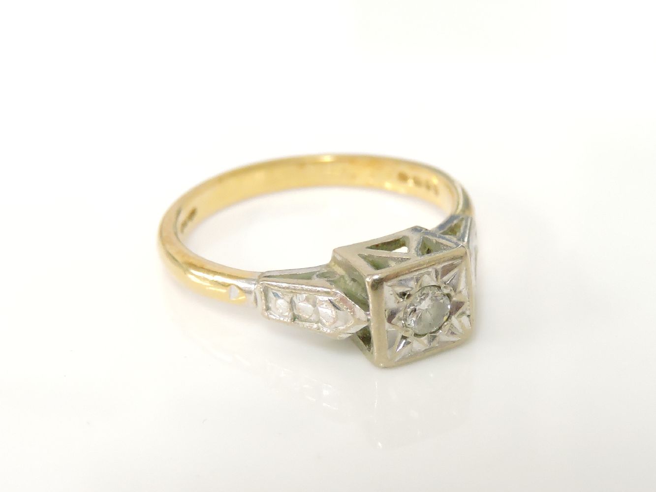An 18ct gold brilliant cut single stone diamond ring, in box collet illusion setting, 18ct gold