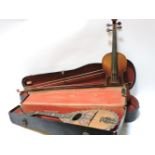 A 19th century violin, with label for 'Giovan Paolo Magini Brescia 1609', a bow stamped Penzel,