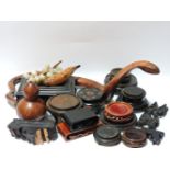 A box of Eastern wooden items, including a snake