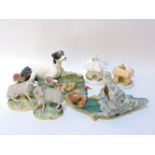 A Copeland and Garrett hunting dog group, restored, a pair of Staffordshire sheep spill vases,