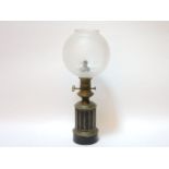 A Victorian brass oil lamp, with shade