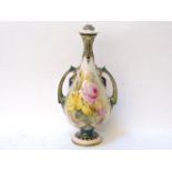 A Royal Worcester bottle vase, of ovoid form, with pierced handles to either side and decorated with