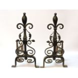 A pair of wrought iron firedogs