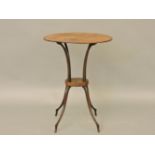 A Regency occasional table, with outswept legs and an undertier, 54cm wide