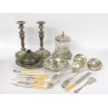 A collection of mixed flatware, a pair of candlesticks, a biscuit barrel, cracked, etc
