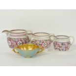 Three 19th century Sunderland lustre jugs, and a Coalport consommé cup