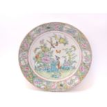 A Chinese famille rose dish, painted with birds and flowers, 37cm diameter