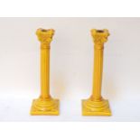 A pair of Burmantofts yellow candlesticks