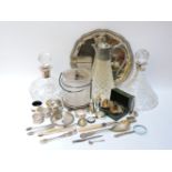 Two silver mounted decanters, together with an assortment of silver plated items