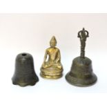 A Tibetan bronze Buddha, 12cm, and two bells