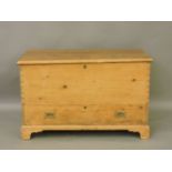 A pine mule chest, the hinged top over two further drawers, 126cm wide