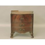 A George III mahogany serpentine commode, damaged