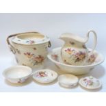 A Cauldon pottery wash bowl and jug set, decorated with floral sprays