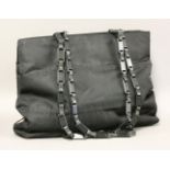 A Prada black canvas handbag, with black leather and plastic chain straps