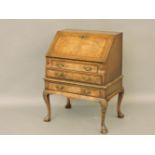 A Queen Anne style walnut and feather strung writing desk, 68.5cm wide