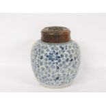 A late 18th century blue and white jar, painted overall with spiralling lotus flowers and squiggles,