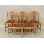 A set of five Georgian mahogany dining chairs