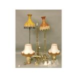Brass light fittings, three standard lamps, chandelier, table lights