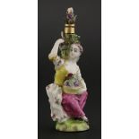A 'Girl in a Swing' type gold-mounted porcelain scent bottlemodelled as a lady seated by a vine, her