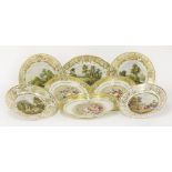 A collection of Derby porcelain plates, c.1825, each with gilt borders, one oval dish and two