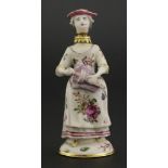A Chelsea gold-mounted porcelain scent bottle,modelled as a lady playing a hurdy-gurdy, her head