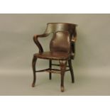 An early 20th century office chair (left arm loose)