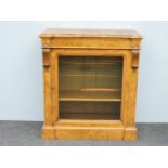 A 19th century walnut single door pier cabinet, in the manner of Gillows