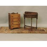 An early 20th century oak demi lune with barley twist legs, a four drawer chest and a carpet