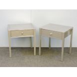 A pair of steel contemporary bedside tables