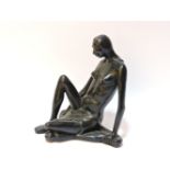 A terracotta seated nude figure