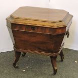 An early 19th century Regency mahogany cellarette, on short sabre legs(interior relined)
