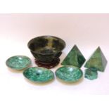 A collection of modern malachite items, two pyramids, 12.5cm high, three bowls, a box and cover, a