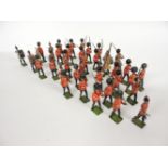 A large quantity of Britains Welsh Guard bandsmen and riflemen, with die cast and painted Desert